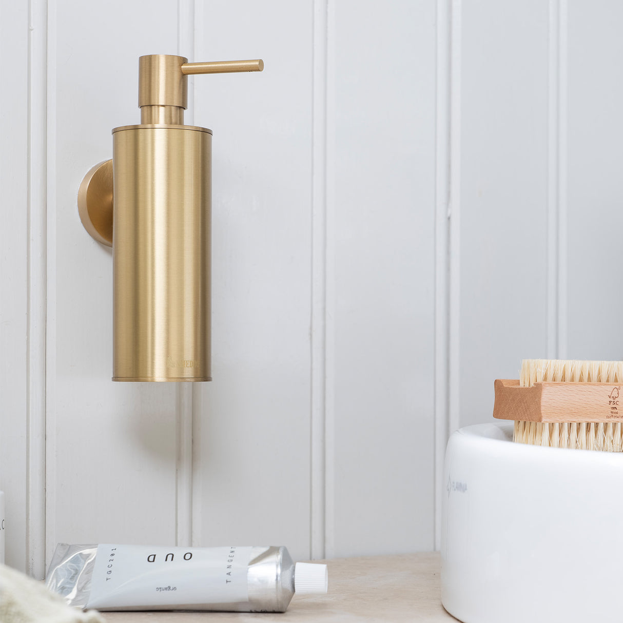 Smedbo Home Wall Mounted Soap Dispenser in Brushed Brass lifestyle